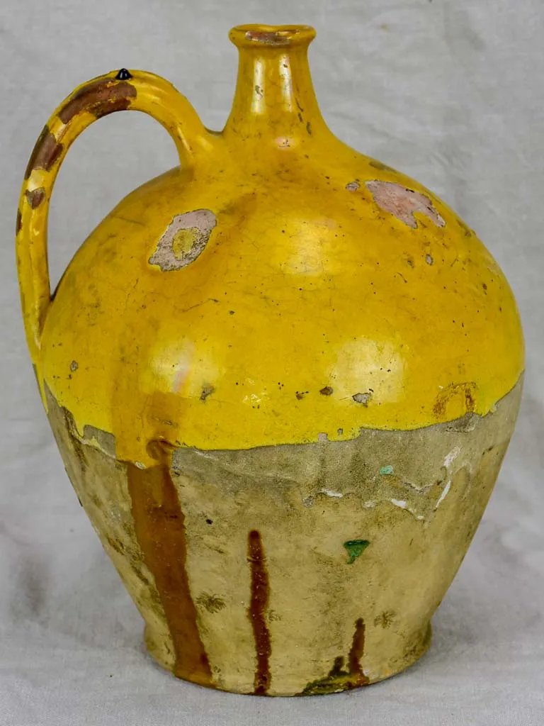 19th Century French water pitcher with yellow glaze