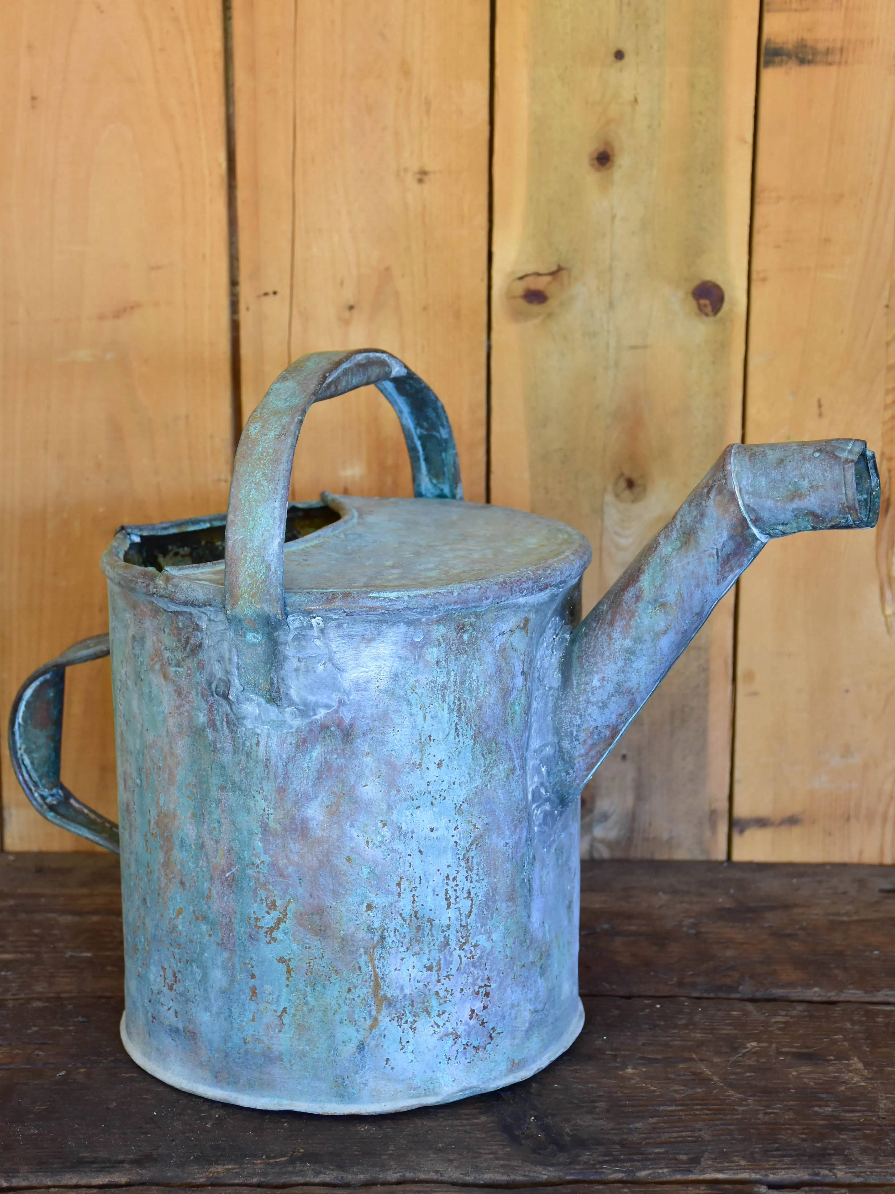 Antique French watering can with bent spout