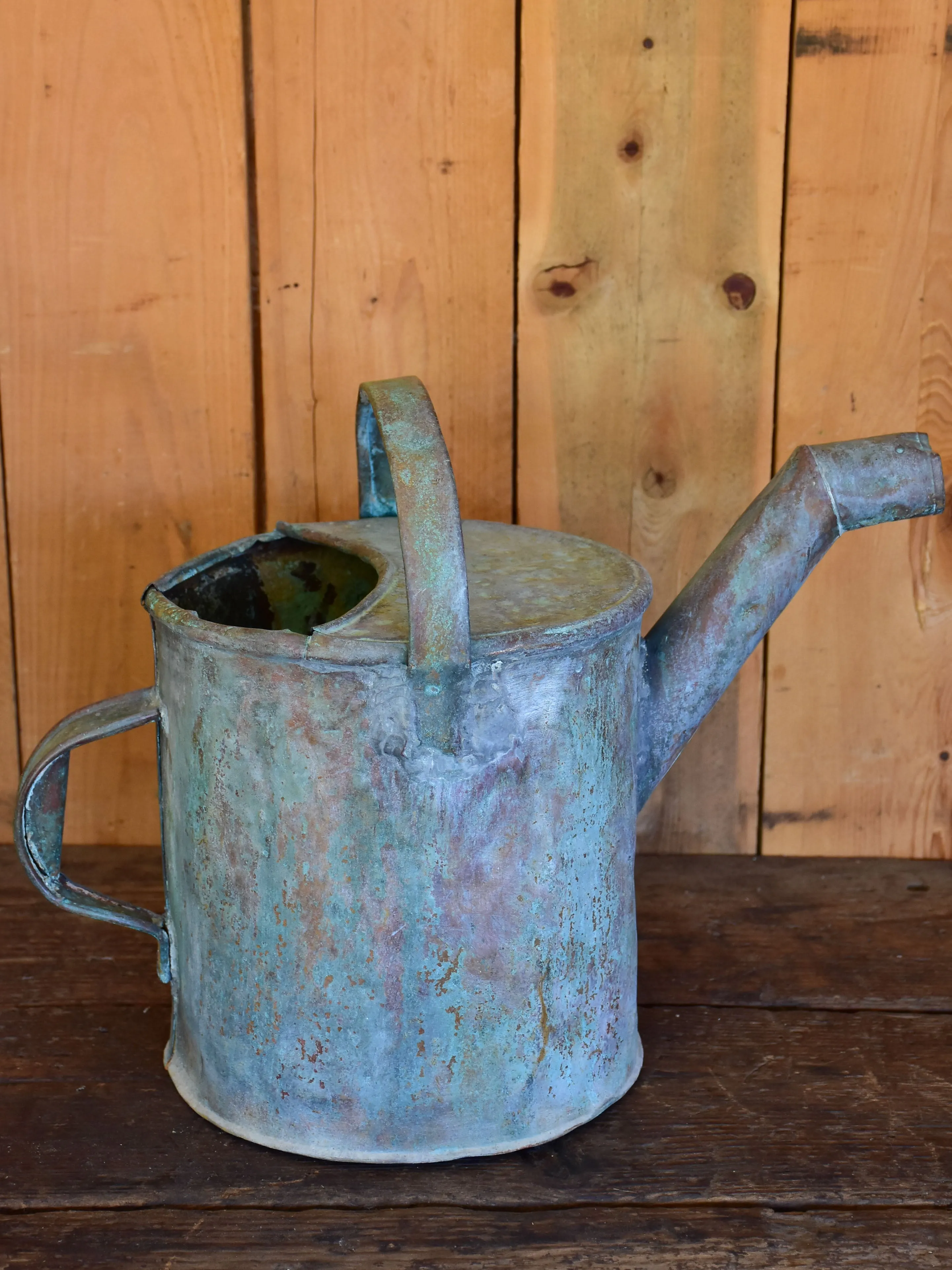 Antique French watering can with bent spout